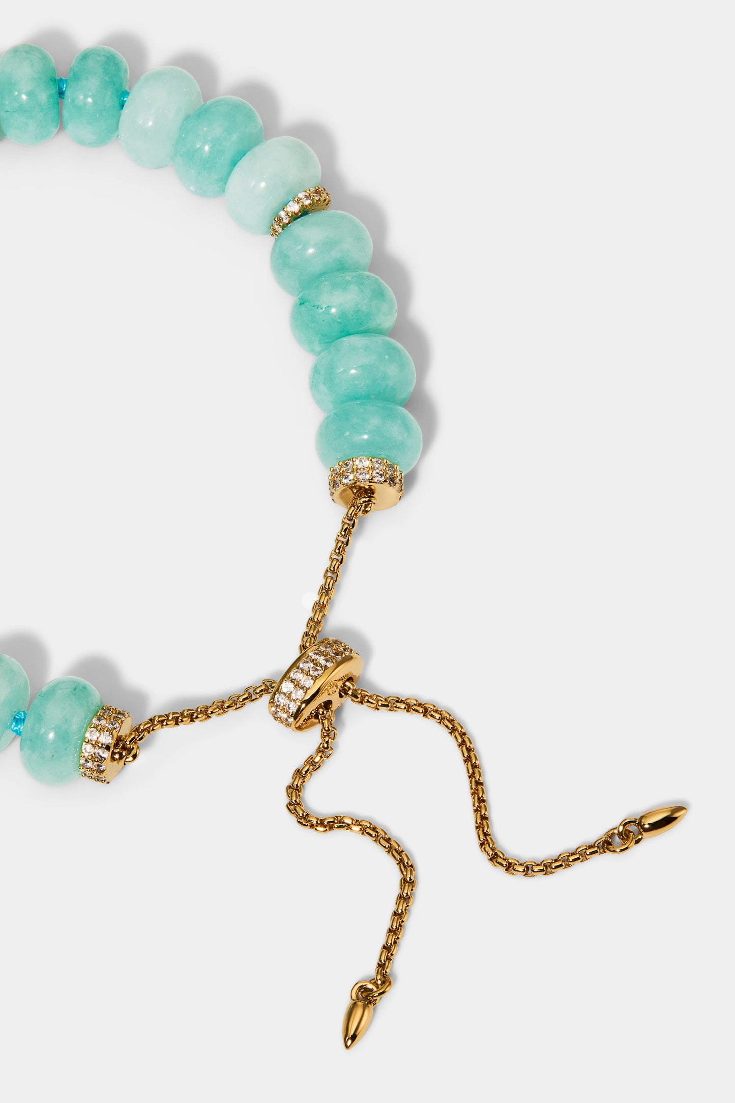 CLOSE UP OF THE BOLO CLOSURE ON THE BEADS OF PARADISE AMZ RNDL BOLO BRACELET