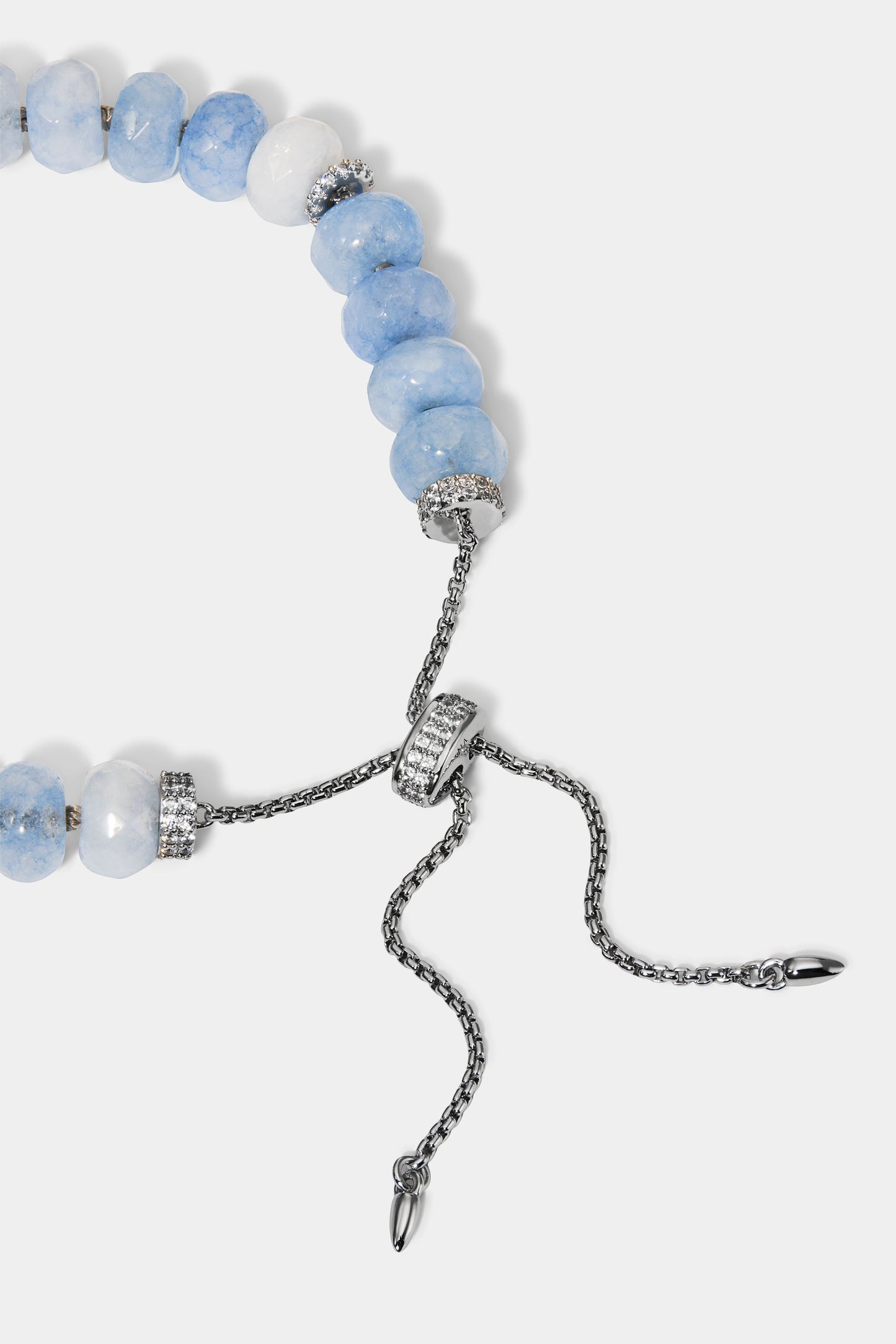 CLOSE UP OF THE BOLO DETAIL ON THE BEADS OF PARADISE BLUE RNDL BOLO BRACELET