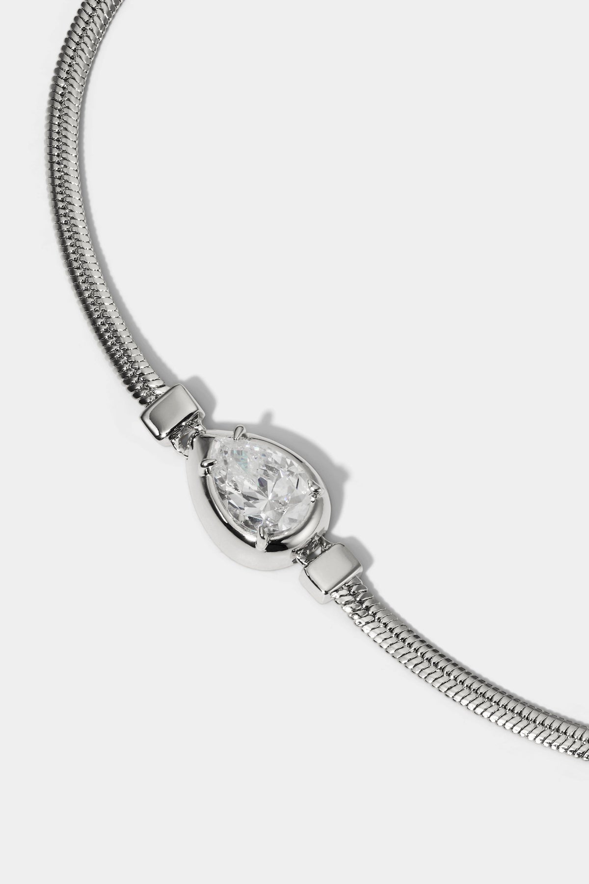 CLOSE UP OF THE PEAR STONE ON THE DELANCEY PEAR LINE BRACELET IN RHODIUM PLATING