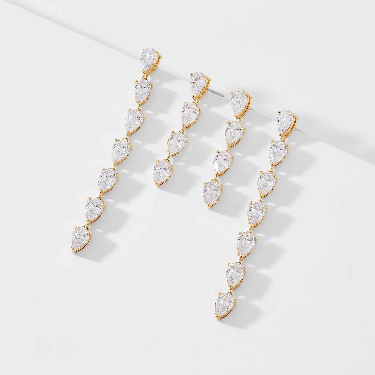TENNIS ANYONE CHASING PEAR CZ SET OF EARRINGS