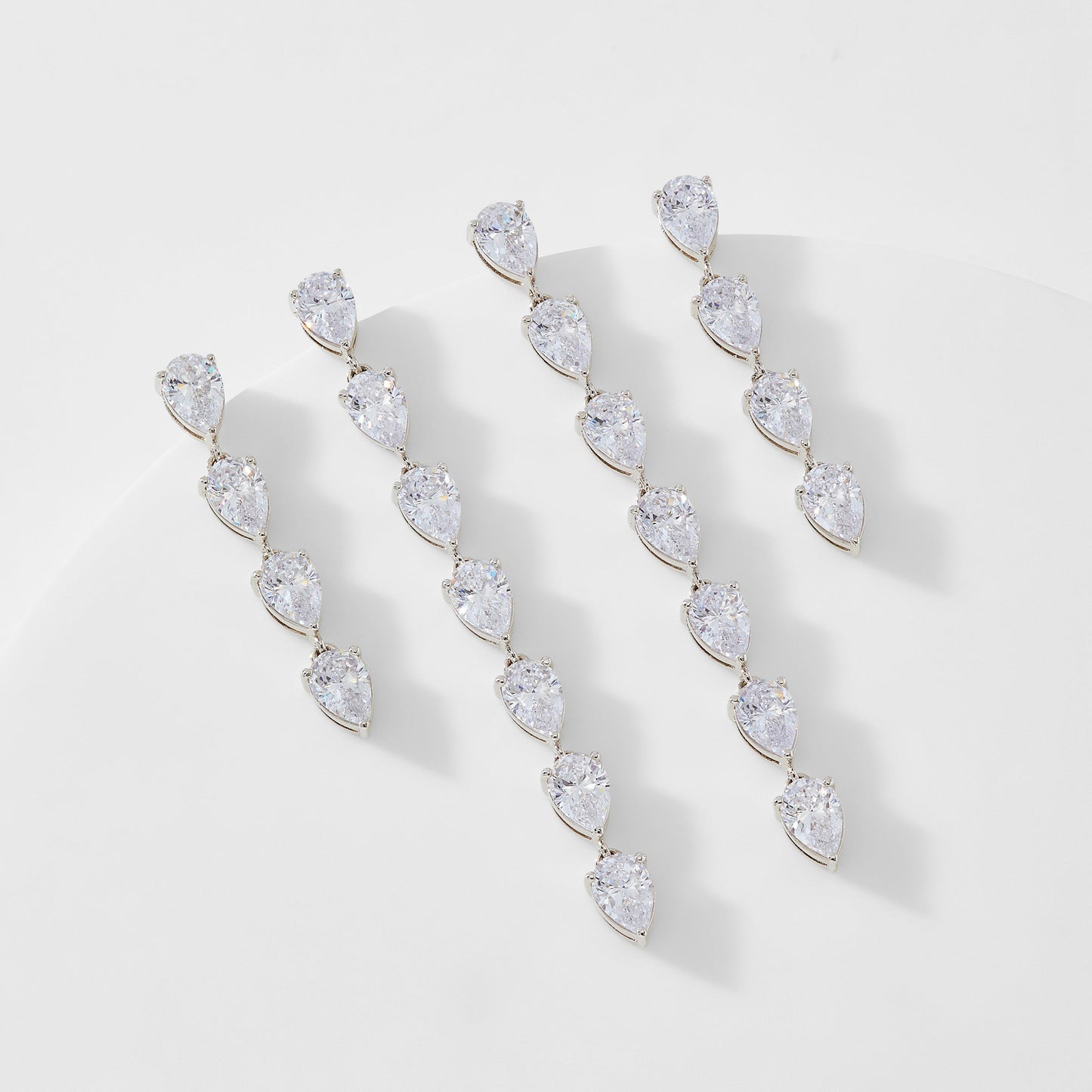 TENNIS ANYONE CHASING PEAR CZ SET OF EARRINGS
