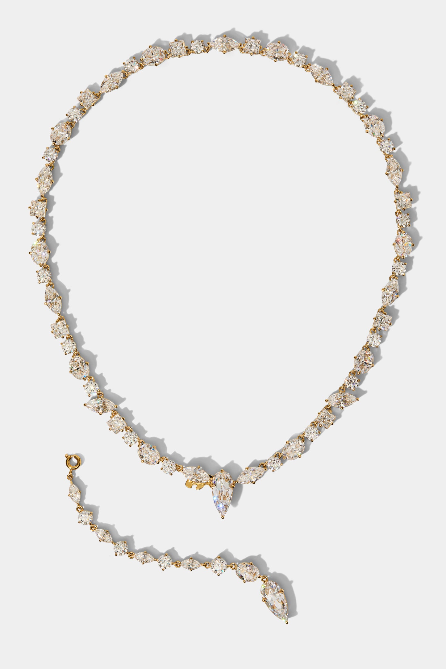 THE RIVIERA CONVERTIBLE Y NECKLACE IN GOLD PLATING, WITH THE Y-DROP ATTACHMENT REMOVED AND PLACED ON THE SIDE OF THE COLLAR