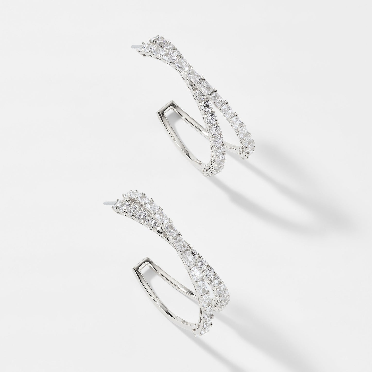 EMERALD ISLE CROSSED CZ HOOP EARRINGS