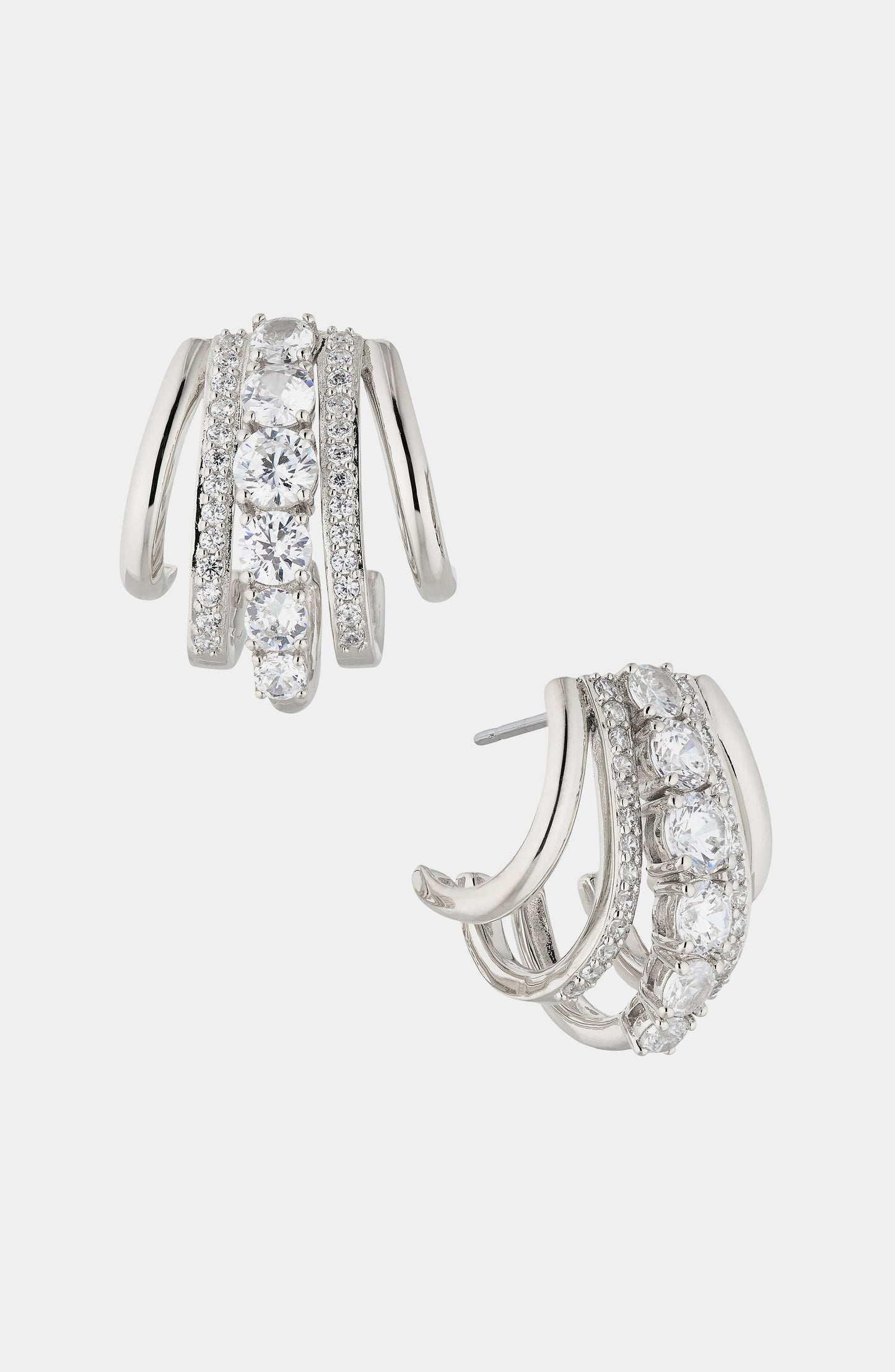 CLEO J HOOP CZ HUGGIE EARRINGS IN RHODIUM PLATING.