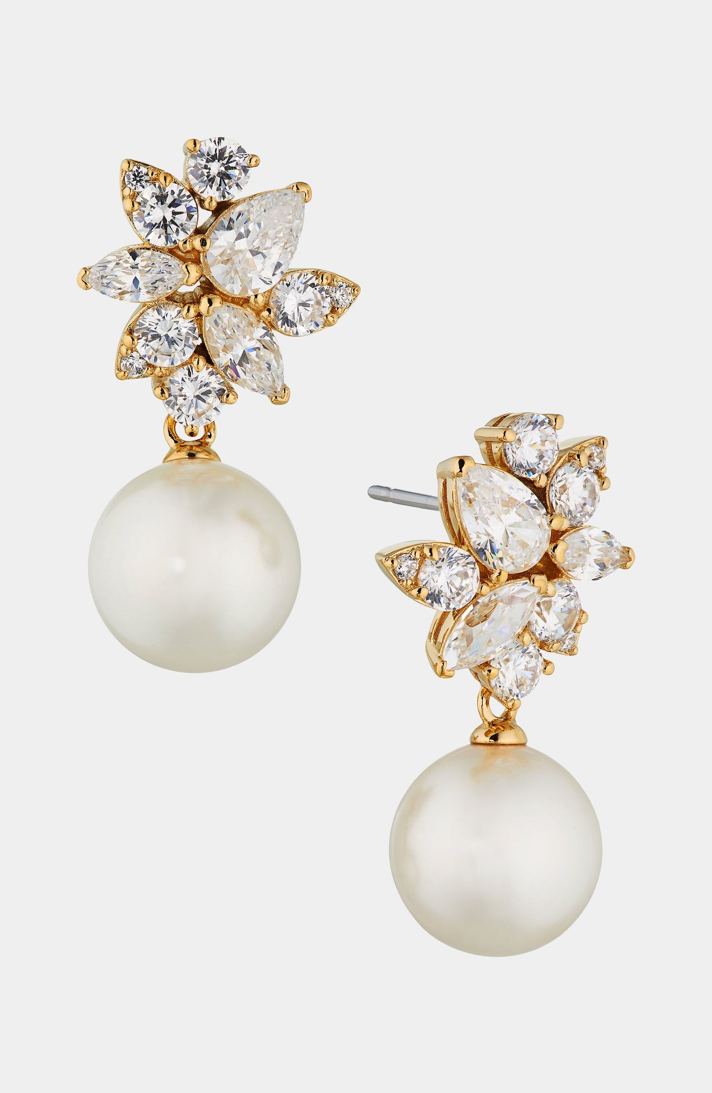 Pair of Nadri's Chiara Pearl Drop Earrings with floral cubic zirconia accents in 18 kt gold plating over brass.