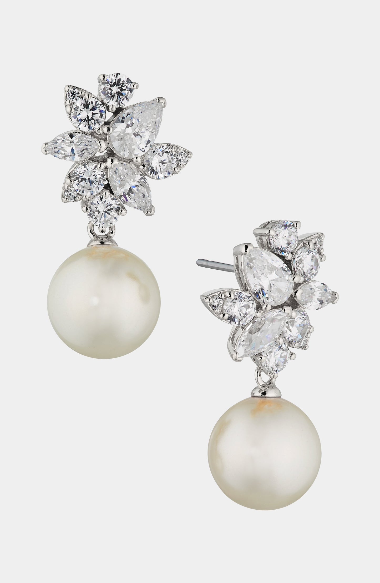 Pair of Nadri's Chiara Pearl Drop Earrings with floral cubic zirconia accents in rhodium plated brass.