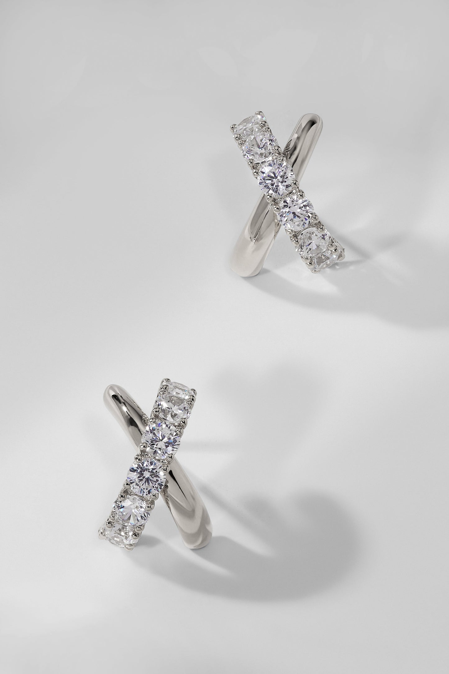TWILIGHT CROSS J HOOP EARRINGS
