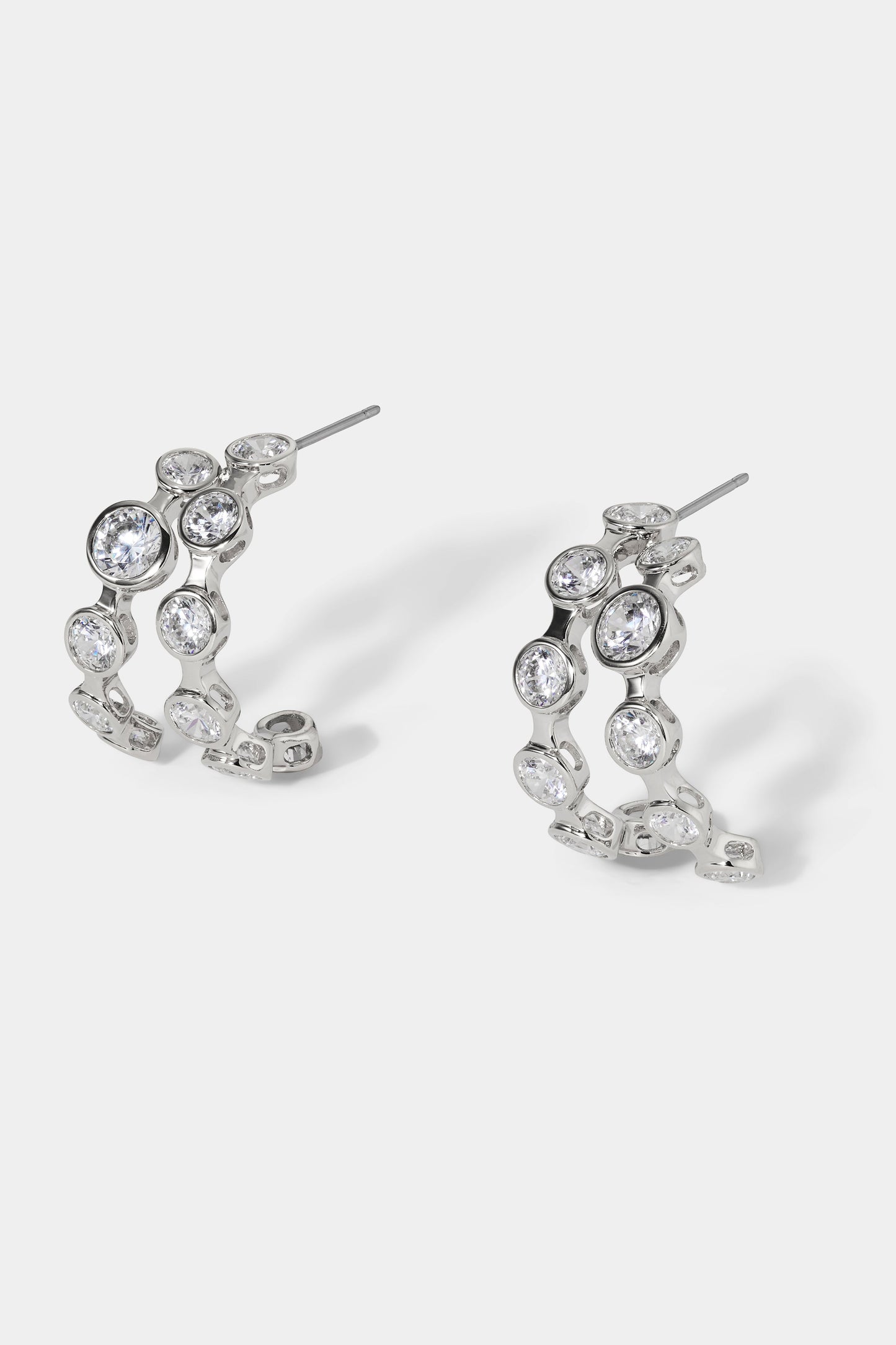 SIDE VIEW OF BROOKLYN DOUBLE ROW C HOOP EARRINGS IN RHODIUM PLATING