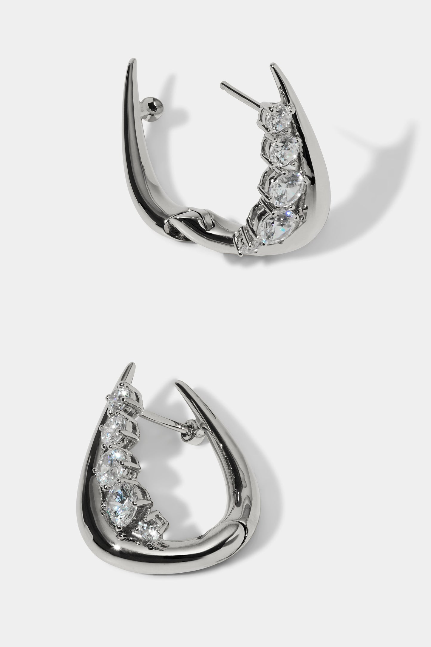 SIDE DETAIL VIEW OF PHENOM HUGGIE EARRINGS IN RHODIUM PLATING