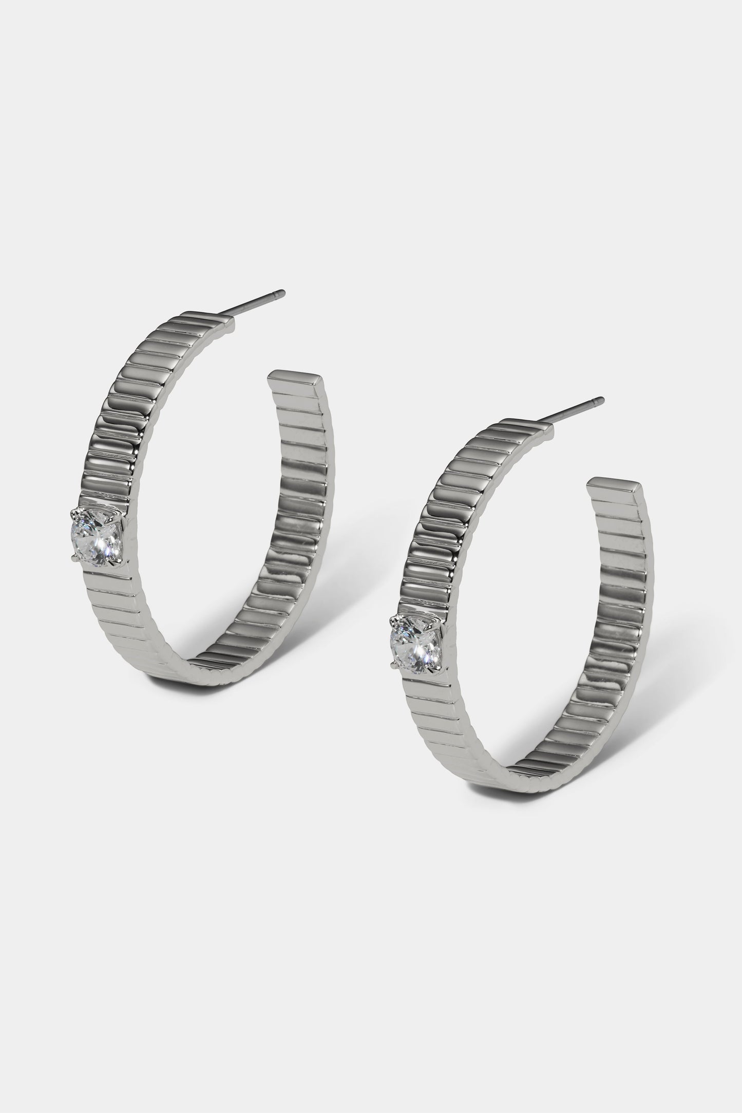 DELANCEY LARGE C HOOP EARRINGS IN RHODIUM PLATING