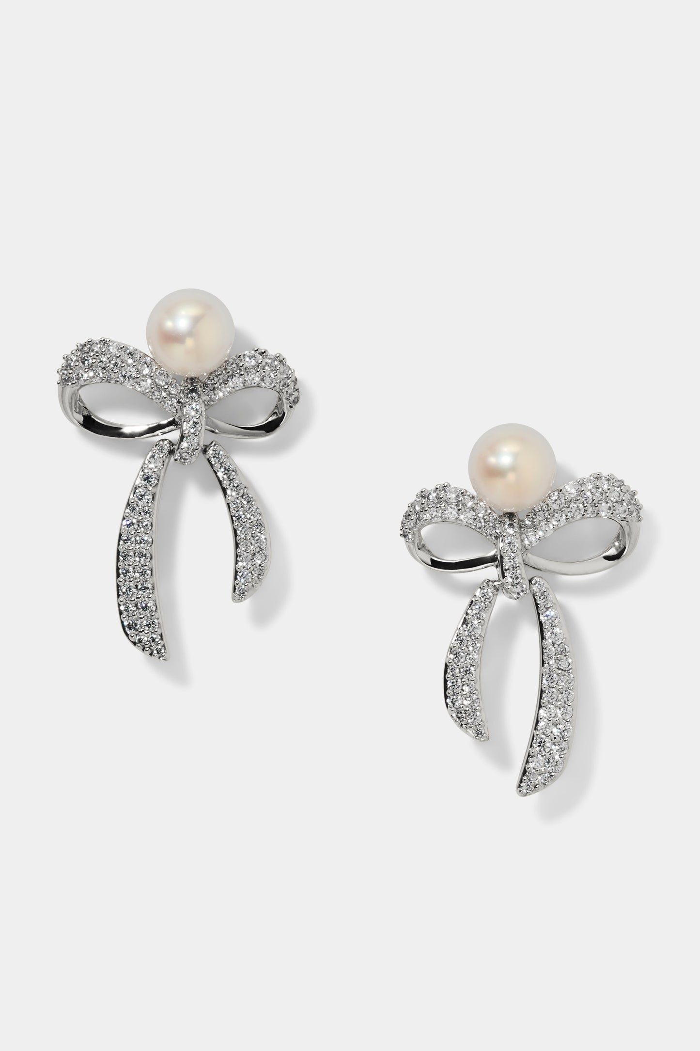 EROS SMALL BOW AND PEARL EARRINGS IN RHODIUM PLATING
