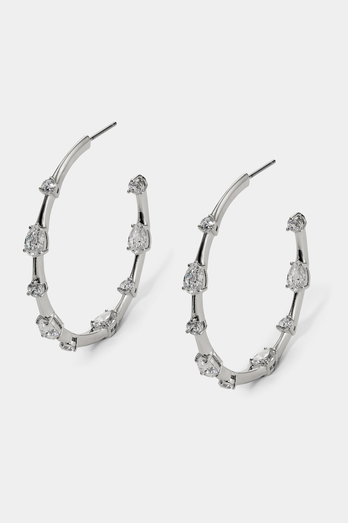 HERA ELONGATED C HOOP EARRINGS IN RHODIUM PLATING