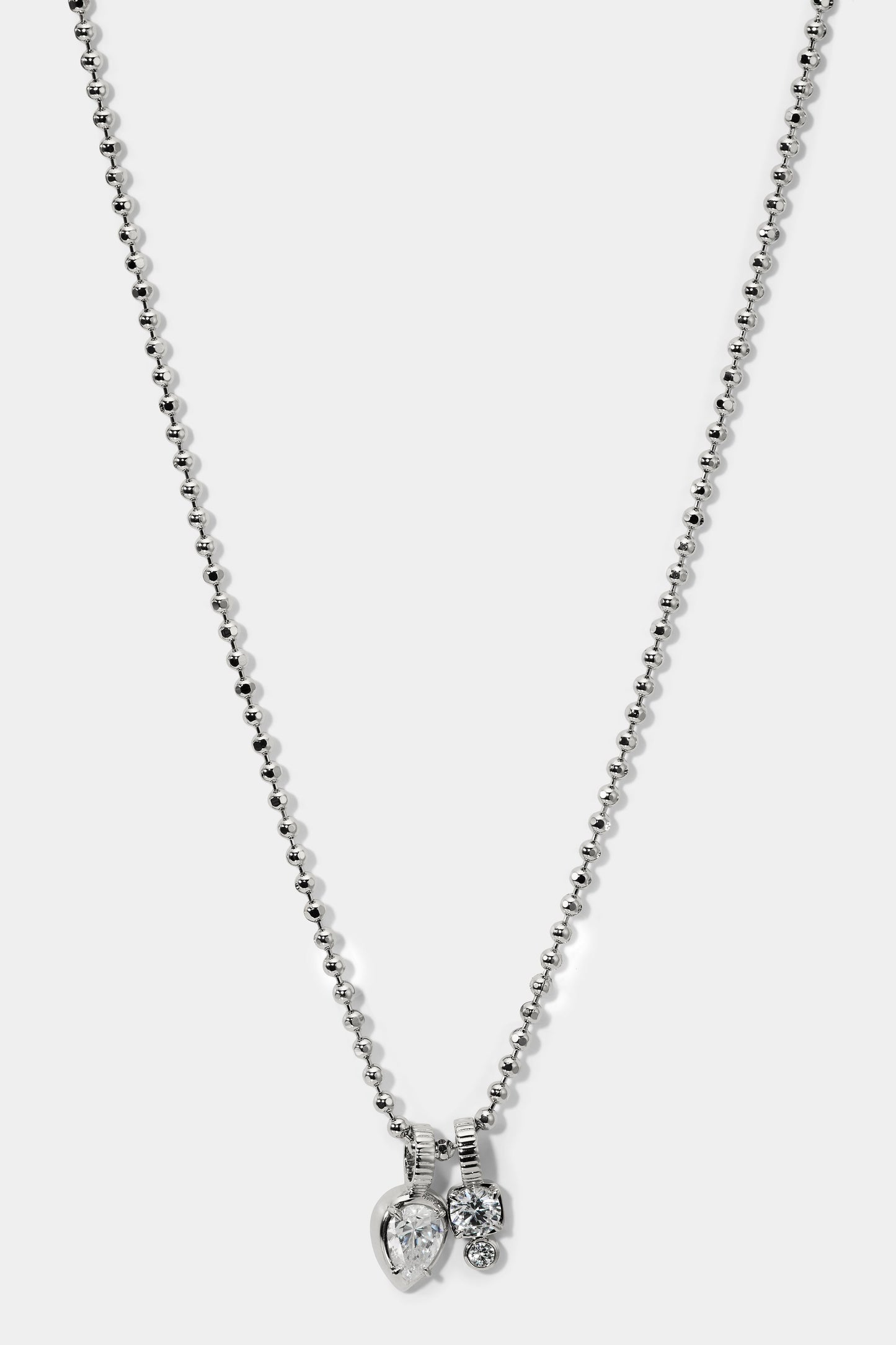 DELANCEY CHARM PENDANT NECKLACE IN RHODIUM PLATING