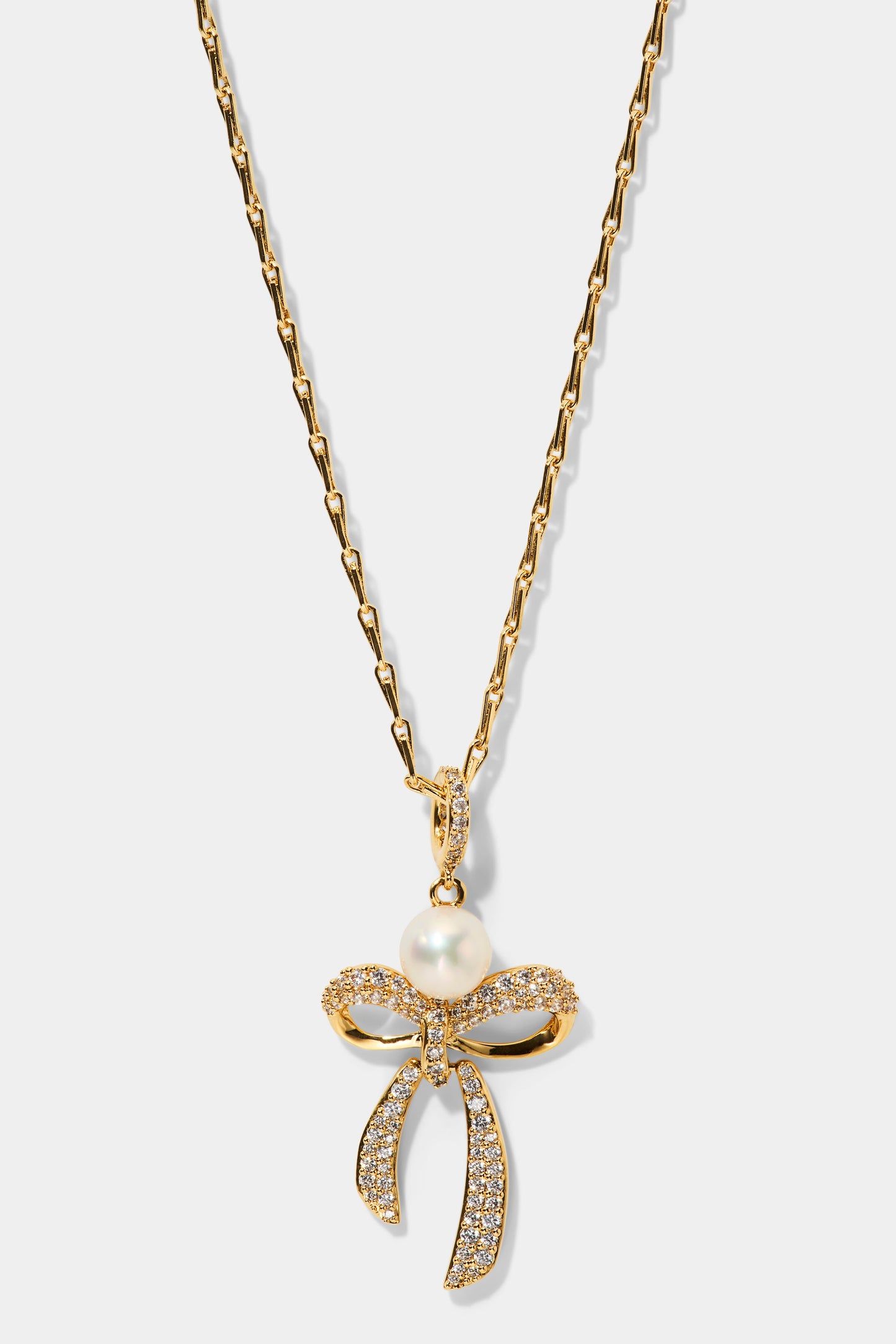 EROS BOW AND PEARL PENDANT NECKLACE IN GOLD PLATING