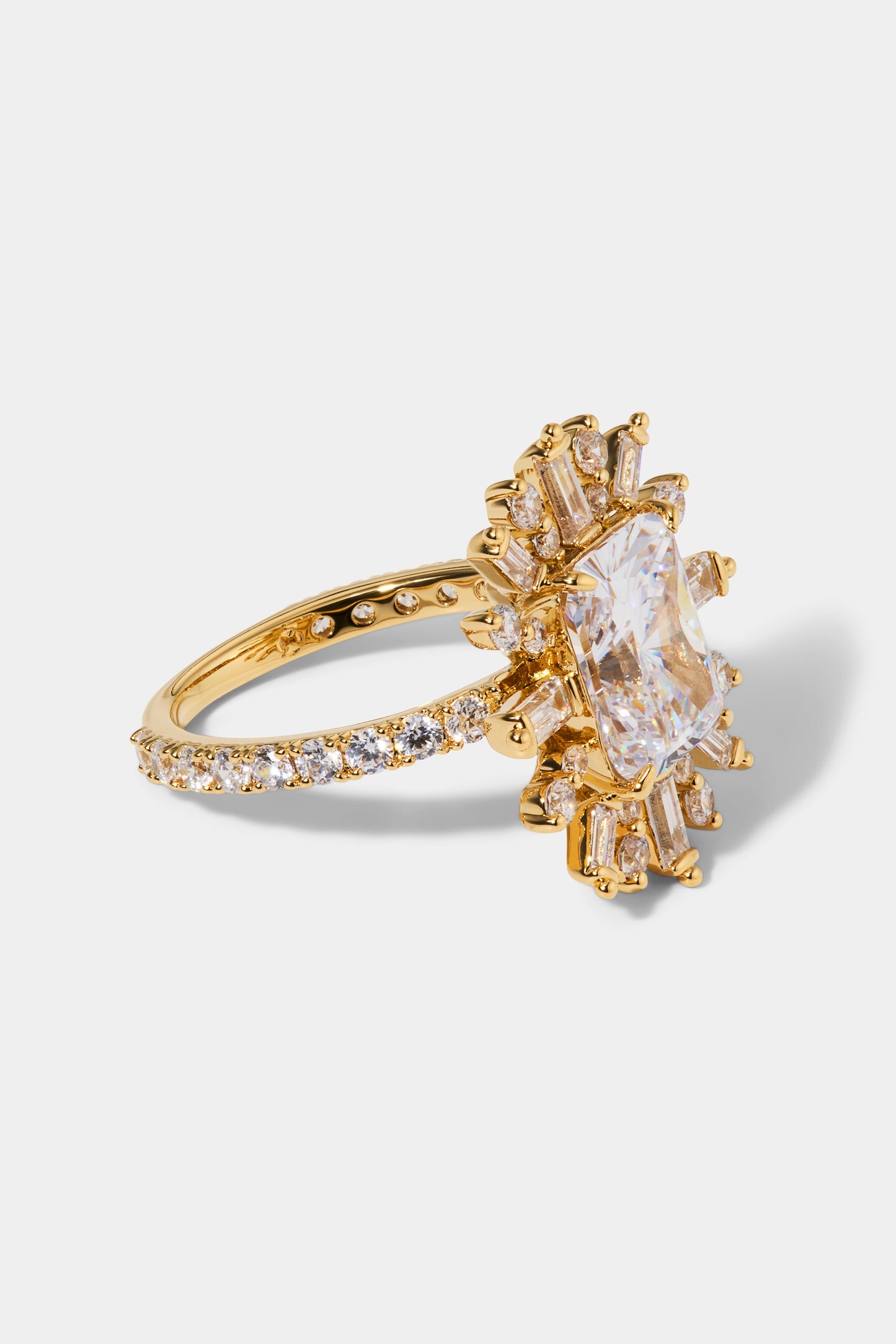 SIDE ANGLE OF STELLAR CZ HALO RING IN GOLD PLATING