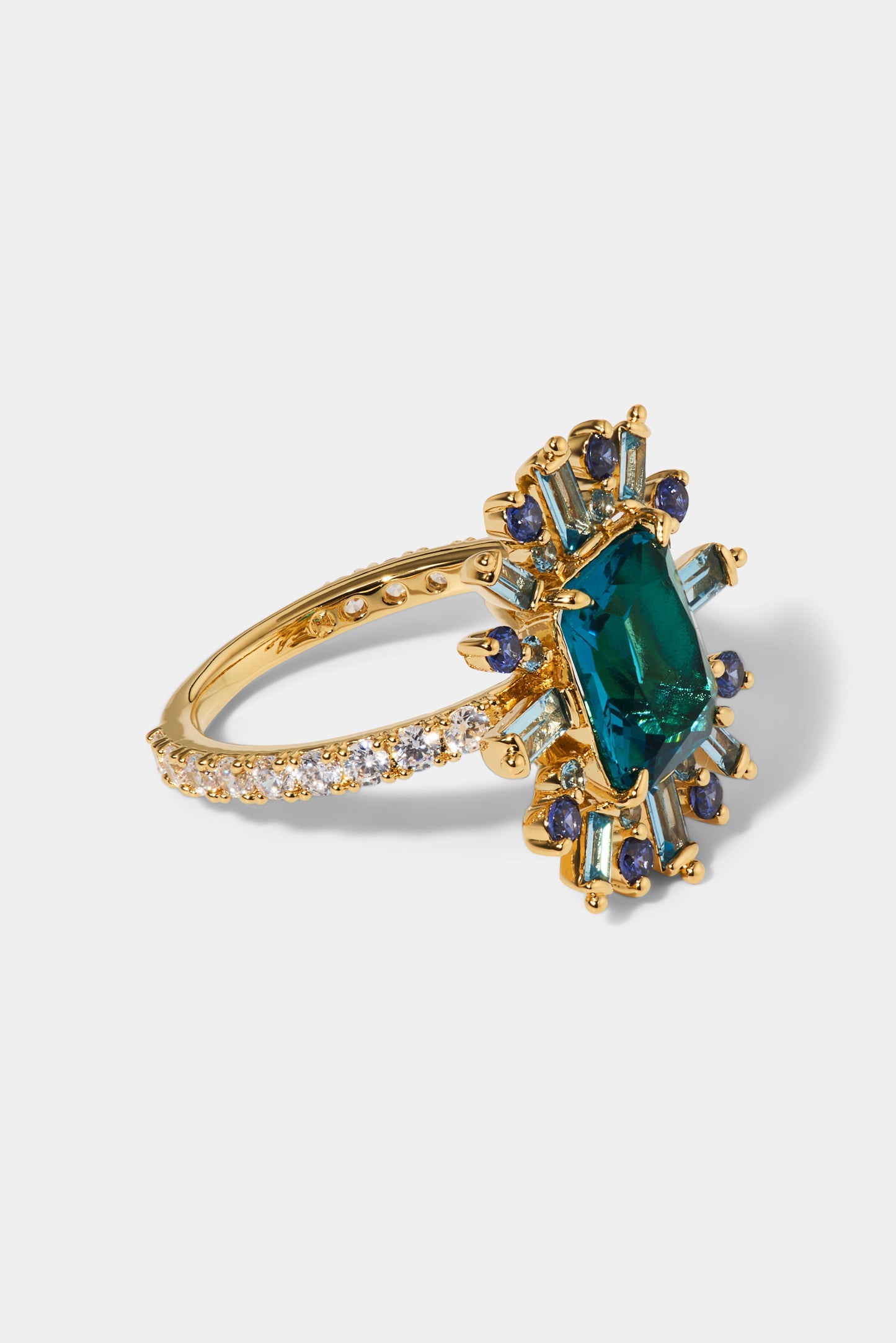 SIDE VIEW OF STELLAR MULTI STONE HALO RING IN GOLD PLATING