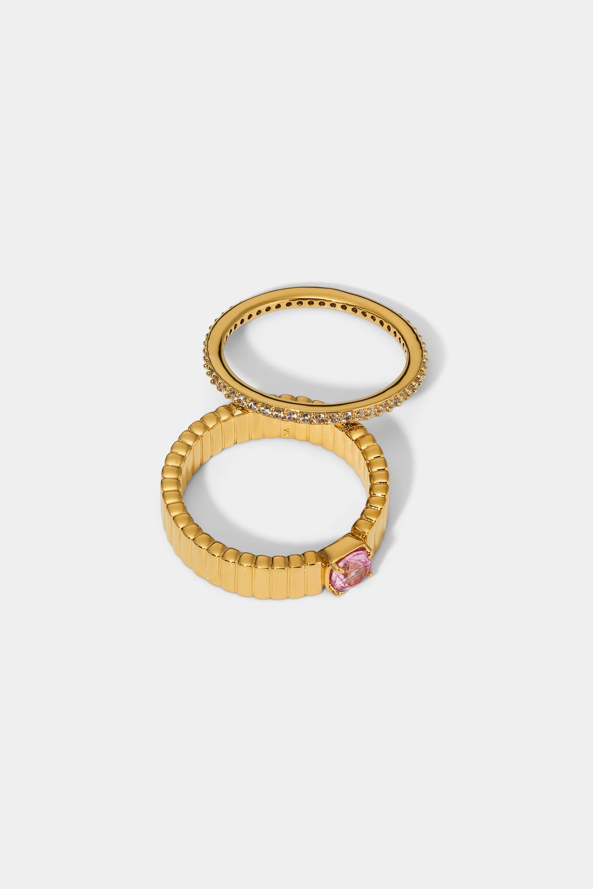 DELANCEY PINK SOLITAIRE RING IN GOLD PLATING, SLIGHTLY SEPARATED TO SHOW THE SEPARATE RINGS