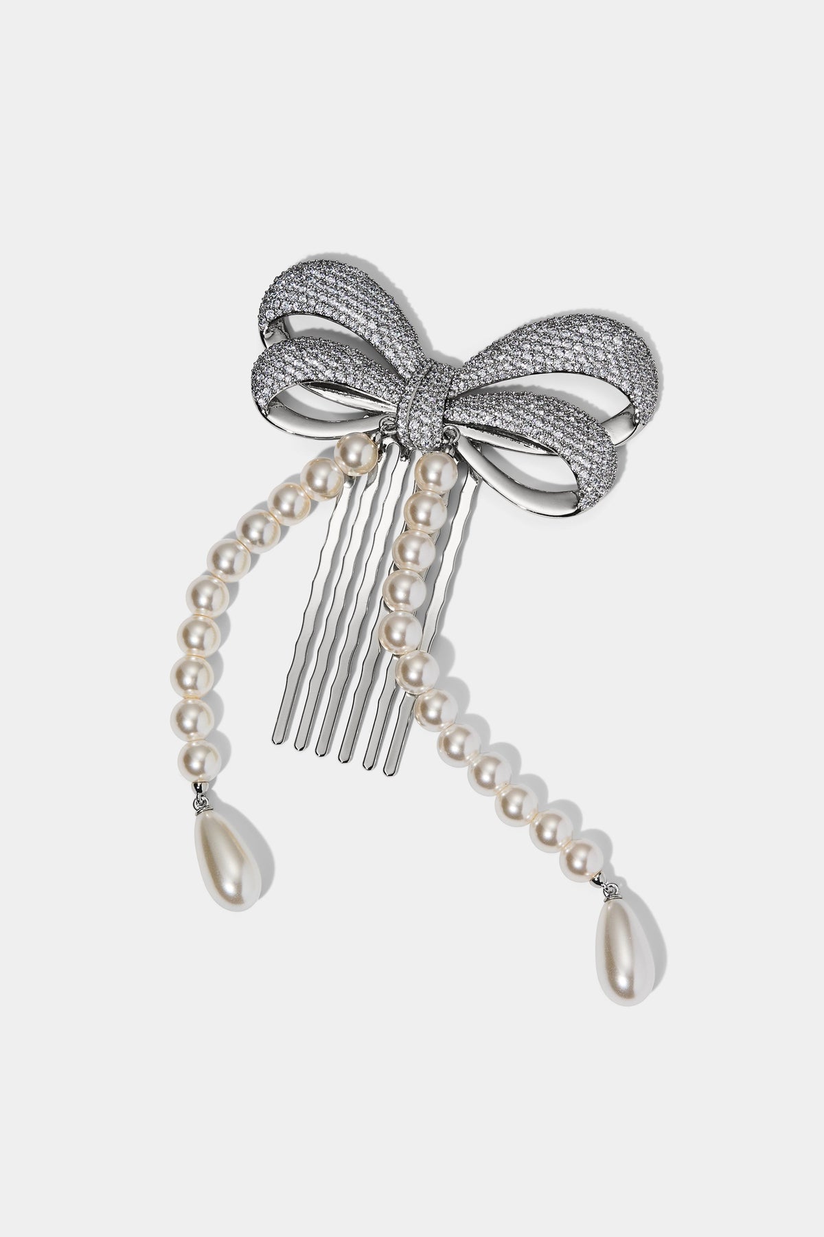 BOW PEARL STRAND HAIR COMB IN A SILVER TONE
