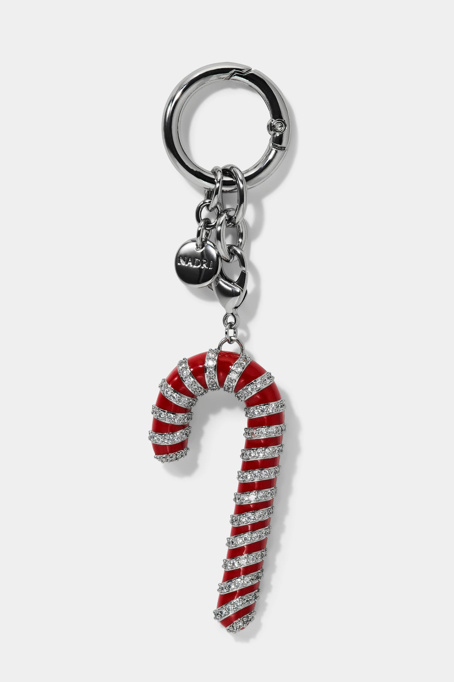 Candy cane-shaped bag charm with pave cubic zirconia accents on a white background