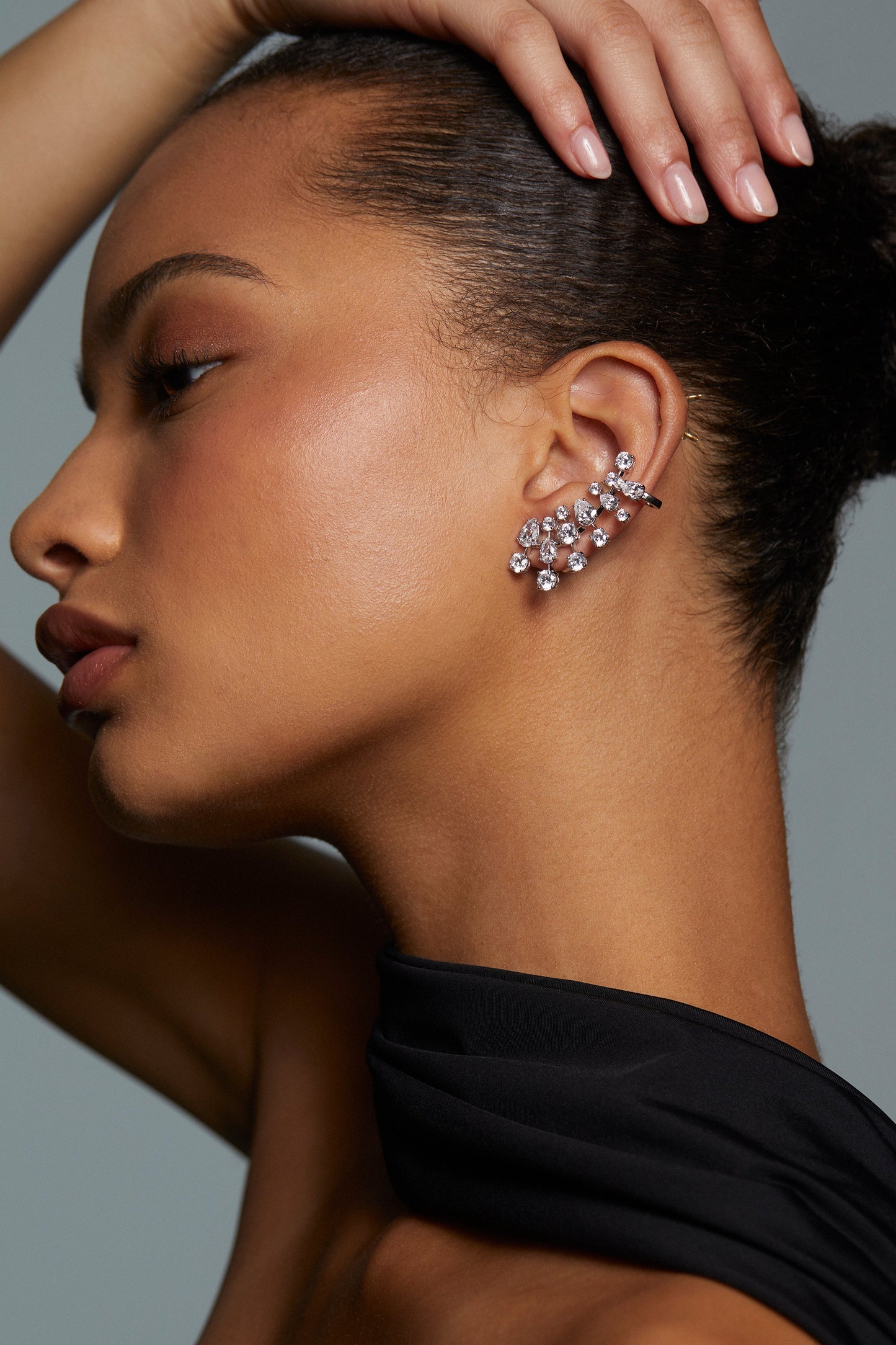 Model wearing cluster climber earrings with mixed-CZ stones.
