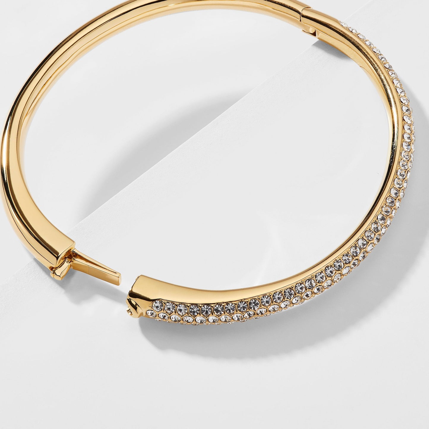 HALF PAVE CZ HINGED OVAL BANGLE