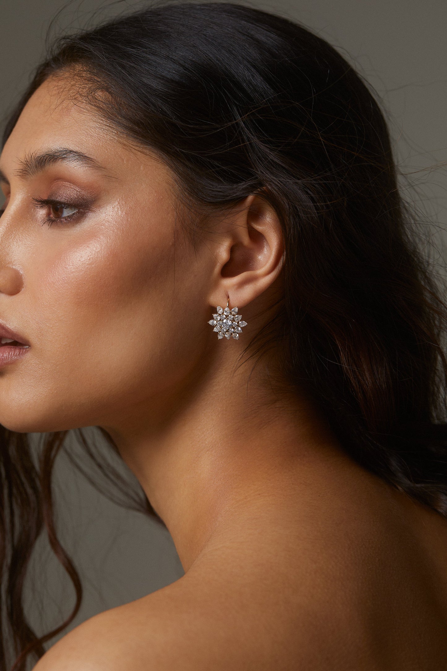 MODEL WEARING DAHLIA CLUSTER LEVERBACK EARRINGS.