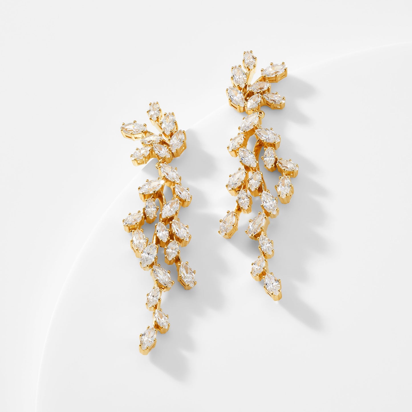 VOW DRAMA MARQUISE CZ EARRINGS IN GOLD PLATING.