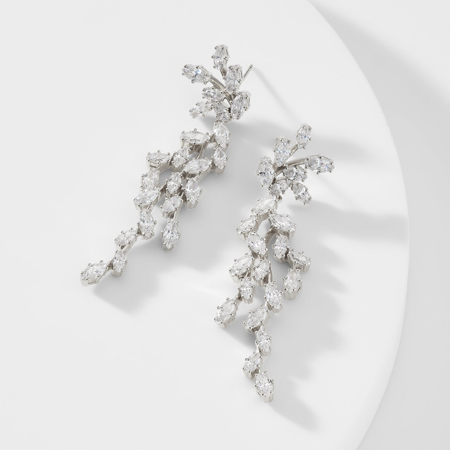 VOW DRAMA MARQUISE CZ EARRINGS IN RHODIUM PLATING.