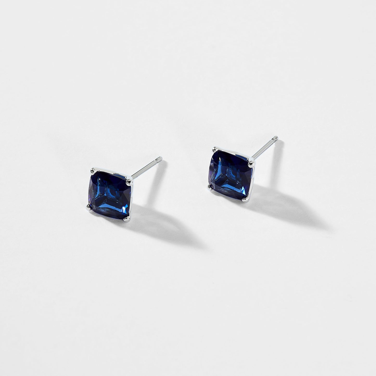 MODERN LOVE LARGE CUSHION CUT FAUX SAPPHIRE STUD EARRINGS