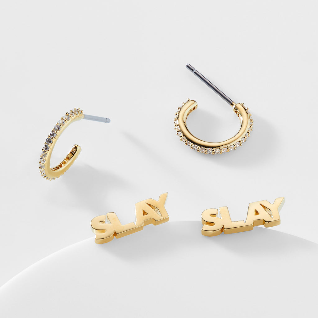 Small gold pave cubic zirconia stud earrings and gold stud earrings that say "Slay"